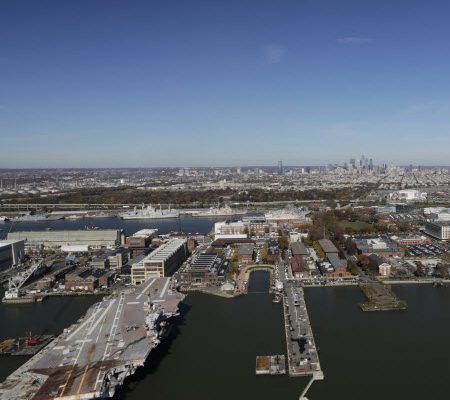 Daytime aerial view of Philadelphia Navy Yard with docks in the foreground