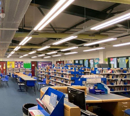 Interior view of a library with LED overhead lights in West Lothian