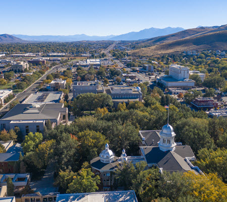 Daytime aerial view of Carson City with mountains in the distance