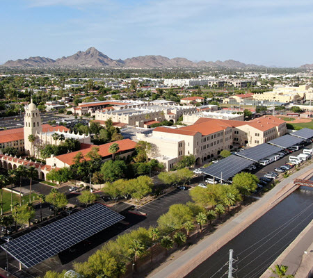 Aerial view of Brophy College Preparatory School showing solar carport systems in the parking lot