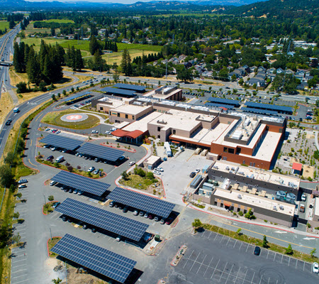 Daytime aerial view of Santa Rosa Hospital showing solar carports