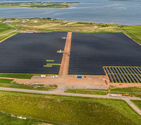 Daytime aerial view of a solar farm at Slemon Park