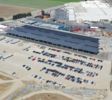 Daytime aerial view of a solar carport at Taylor Farms