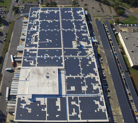 Daytime aerial view of solar panels on the roof of a USPS building in Bellmawr New Jersey