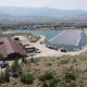 Daytime aerial view of a floating solar energy farm at Mountain Water Special Service District in Utah